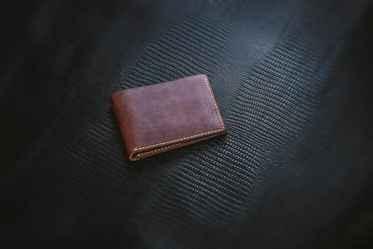 services-02 Vintage Wallet against black leather backdrop